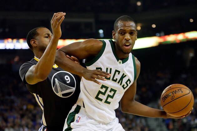 OAKLAND, CA - MARCH 18:  Khris Middleton #22 of the Milwaukee Bucks controls the ball as Andre Iguodala #9 of the Golden State Warriors defends during the game at ORACLE Arena on March 18, 2017 in Oakland, California.  (Photo by Jamie Squire/Getty Images)