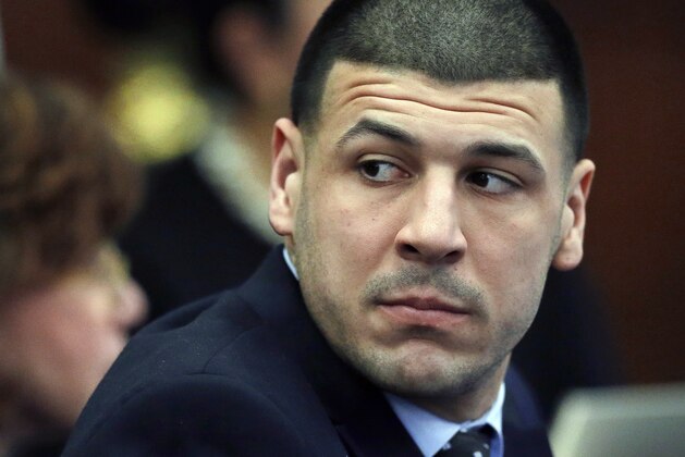 Defendant Aaron Hernandez listens during his double murder trial in Suffolk Superior Court, Wednesday, March 29, 2017, in Boston. Hernandez is on trial for the July 2012 killings of Daniel de Abreu and Safiro Furtado who he encountered in a Boston nightclub. The former New England Patriots NFL football player is already serving a life sentence in the 2013 killing of semi-professional football player Odin Lloyd. (AP Photo/Elise Amendola, Pool)
