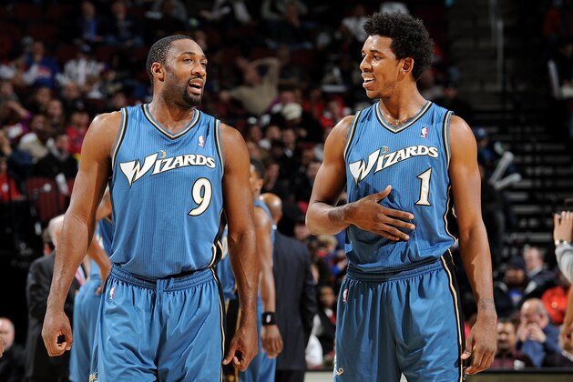 NEWARK, NJ - DECEMBER 16:  (L-R) Gilbert Arenas #9 and Nick Young #1 of the Washington Wizards talk during the game against the New Jersey Nets on December 16, 2010 at the Prudential Center in Newark, New Jersey. NOTE TO USER: User expressly acknowledges and agrees that, by downloading and or using this photograph, User is consenting to the terms and conditions of the Getty Images License Agreement. Mandatory Copyright Notice: Copyright 2010 NBAE  (Photo by David Dow/NBAE via Getty Images)
