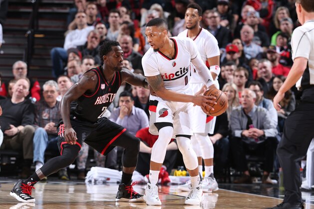 PORTLAND, OR - MARCH 30:  Damian Lillard #0 of the Portland Trail Blazers handles the ball during a game against the Houston Rockets on March 30, 2017 at the Moda Center in Portland, Oregon. NOTE TO USER: User expressly acknowledges and agrees that, by downloading and/or using this photograph, user is consenting to the terms and conditions of the Getty Images License Agreement. Mandatory Copyright Notice: Copyright 2017 NBAE (Photo by Sam Forencich/NBAE via Getty Images)
