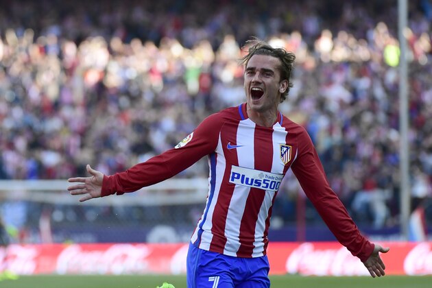 Atletico Madrid's French forward Antoine Griezmann celebrates after scoring during the Spanish league football match Club Atletico de Madrid vs Sevilla FC at the Vicente Calderon stadium in Madrid on March 19, 2017. / AFP PHOTO / PIERRE-PHILIPPE MARCOU        (Photo credit should read PIERRE-PHILIPPE MARCOU/AFP/Getty Images)