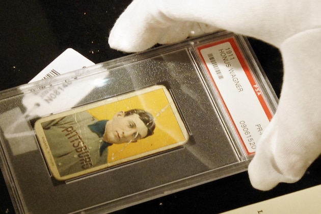 NEW YORK, UNITED STATES:  A rare baseball card of Honus Wagner of the Pittsburgh Pirates, considered to be the best all around player in baseball history, is displayed at a preview of a sports memorabilia sale, 03 June, 2005, at Sotheby's in New York. The estimate for the 10 June sale of the card is 90,000 to 120,000 USD.   AFP PHOTO/Stan HONDA  (Photo credit should read STAN HONDA/AFP/Getty Images)