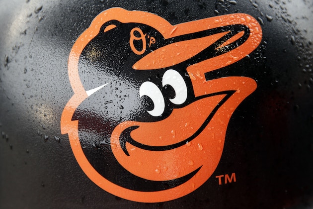 Rain drops stick to a Baltimore Orioles logo on a concourse trash can before a home opener baseball game against the Toronto Blue Jays, Friday, April 10, 2015, in Baltimore, as wet weather threatened the area. (AP Photo/Patrick Semansky)