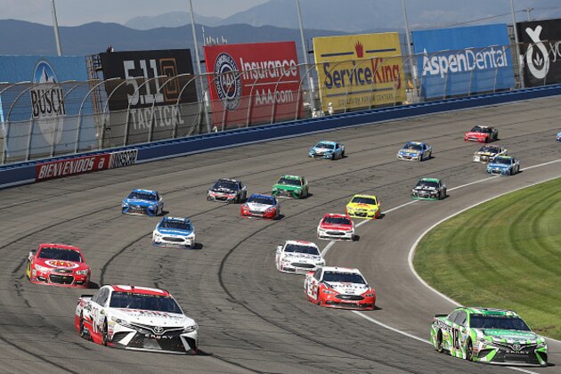 FONTANA, CA - MARCH 26:  Denny Hamlin, driver of the #11 Sport Clips Toyota, races Kyle Busch, driver of the #18 Interstate Batteries Toyota, during the Monster Energy NASCAR Cup Series Auto Club 400 at Auto Club Speedway on March 26, 2017 in Fontana, California.  (Photo by Chris Graythen/Getty Images)