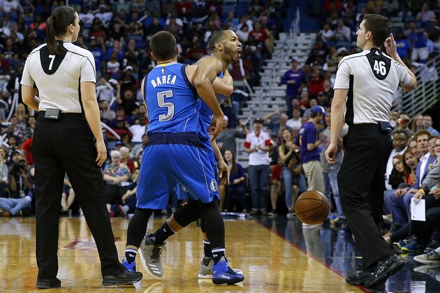 NEW ORLEANS, LA - MARCH 29: J.J. Barea #5 of the Dallas Mavericks holds back Devin Harris #34 as he is ejected by referee Ben Taylor #46 during the first half of a game against the New Orleans Pelicans at the Smoothie King Center on March 29, 2017 in New Orleans, Louisiana. NOTE TO USER: User expressly acknowledges and agrees that, by downloading and or using this photograph, User is consenting to the terms and conditions of the Getty Images License Agreement.  (Photo by Jonathan Bachman/Getty Images)
