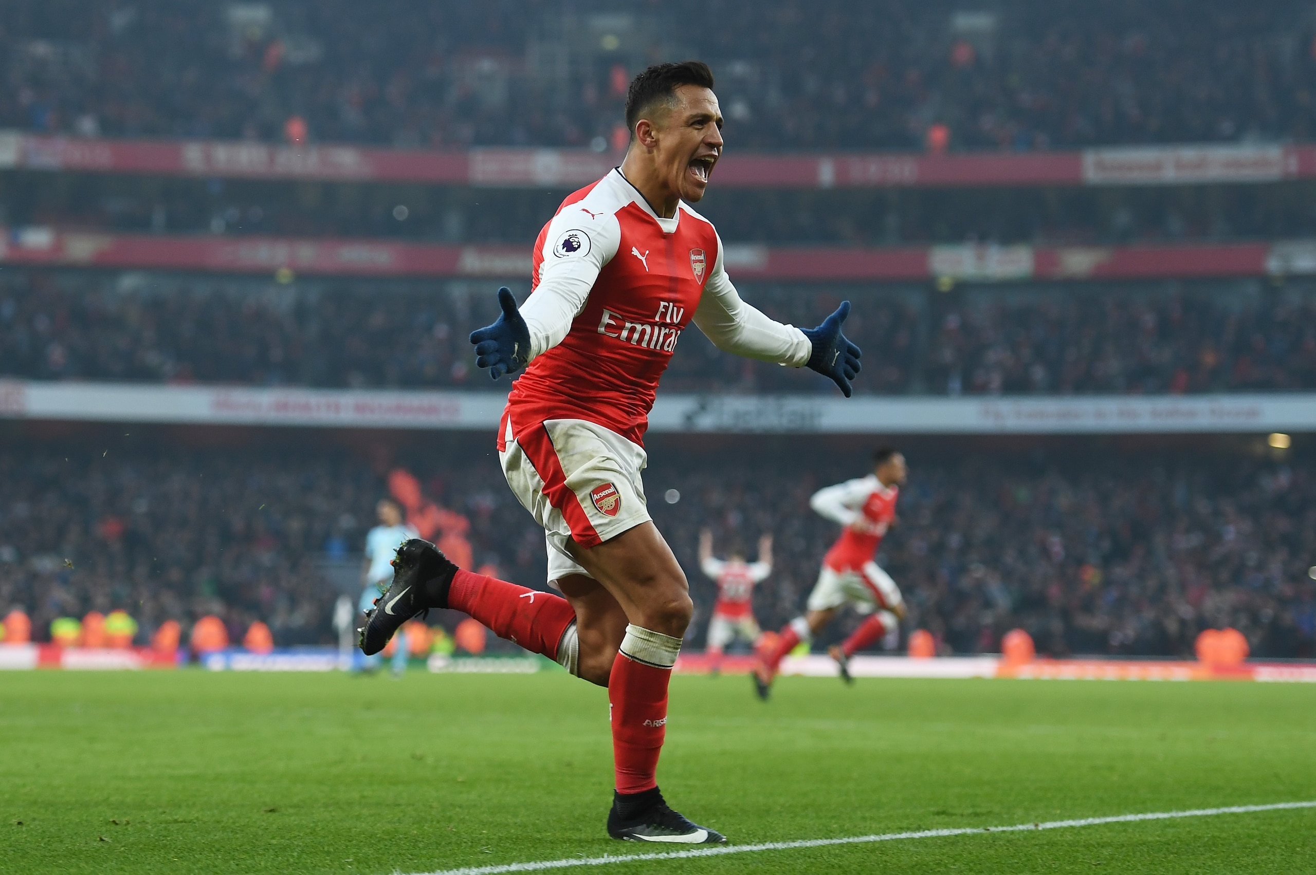 LONDON, ENGLAND - JANUARY 22: Alexis Sanchez of Arsenal celebrates scoring his team's second goal during the Premier League match between Arsenal and Burnley at the Emirates Stadium on January 22, 2017 in London, England. (Photo by Shaun Botterill/Getty Images) LONDON, ENGLAND - JANUARY 22: Alexis Sanchez of Arsenal celebrates scoring his team's second goal during the Premier League match between Arsenal and Burnley at the Emirates Stadium on January 22, 2017 in London, England. (Photo by Shaun Botterill/Getty Images)