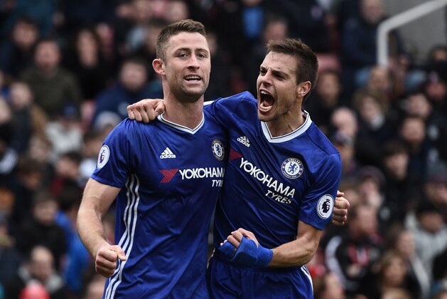 Chelsea's English defender Gary Cahill (L) celebrates with Chelsea's Spanish defender Cesar Azpilicueta after scoring their second goal during the English Premier League football match between Stoke City and Chelsea at the Bet365 Stadium in Stoke-on-Trent, central England on March 18, 2017. / AFP PHOTO / Oli SCARFF / RESTRICTED TO EDITORIAL USE. No use with unauthorized audio, video, data, fixture lists, club/league logos or 'live' services. Online in-match use limited to 75 images, no video emulation. No use in betting, games or single club/league/player publications.  /         (Photo credit should read OLI SCARFF/AFP/Getty Images)