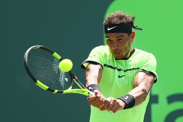 KEY BISCAYNE, FL - MARCH 31:  Rafael Nadal of Spain returns a shot against Fabio Fognini of Italy during Day 12 of the Miami Open at Crandon Park Tennis Center on March 31, 2017 in Key Biscayne, Florida.  (Photo by Al Bello/Getty Images)