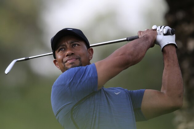 Tiger Woods tees off on the 11th hole during the first round of the Dubai Desert Classic golf tournament in Dubai, United Arab Emirates, Thursday, Feb. 2, 2017. (AP Photo/Kamran Jebreili)