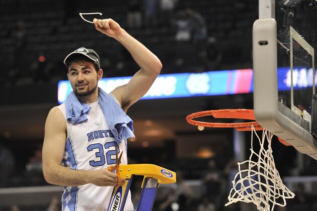 North Carolina forward Luke Maye (32) cuts down the net after North Carolina beat Kentucky in the South Regional final game in the NCAA college basketball tournament Sunday, March 26, 2017, in Memphis, Tenn. Maye shot the winning basket that gave North Carolina a 75-73 win. (AP Photo/Brandon Dill)