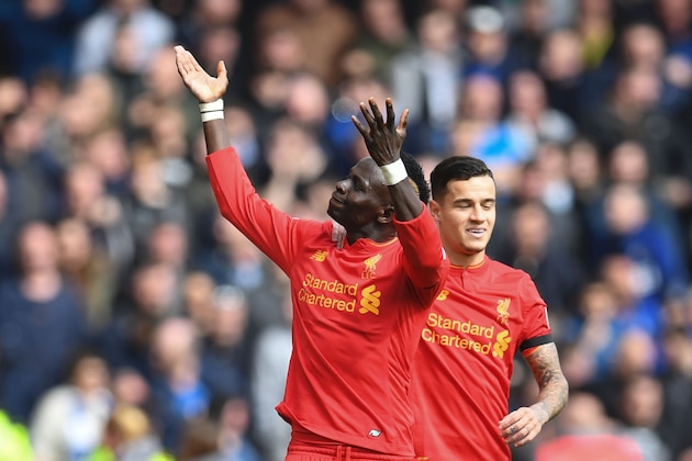 Liverpool's Senegalese midfielder Sadio Mane (L) celebrates with Liverpool's Brazilian midfielder Philippe Coutinho after scoring the opening goal of the English Premier League football match between Liverpool and Everton at Anfield in Liverpool, north west England on April 1, 2017. / AFP PHOTO / Paul ELLIS / RESTRICTED TO EDITORIAL USE. No use with unauthorized audio, video, data, fixture lists, club/league logos or 'live' services. Online in-match use limited to 75 images, no video emulation. No use in betting, games or single club/league/player publications.  /         (Photo credit should read PAUL ELLIS/AFP/Getty Images)
