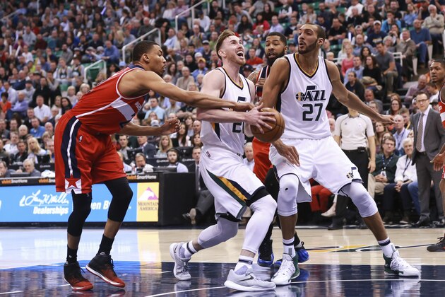 Utah Jazz forward Gordon Hayward (20) is fouled while shooting the ball by Washington Wizards guard John Wall (2) during the fourth quarter of NBA basketball game Friday, March 31, 2017, in Salt Lake City. The Utah Jazz won the game 95-88. (AP Photo/Chris Nicoll)