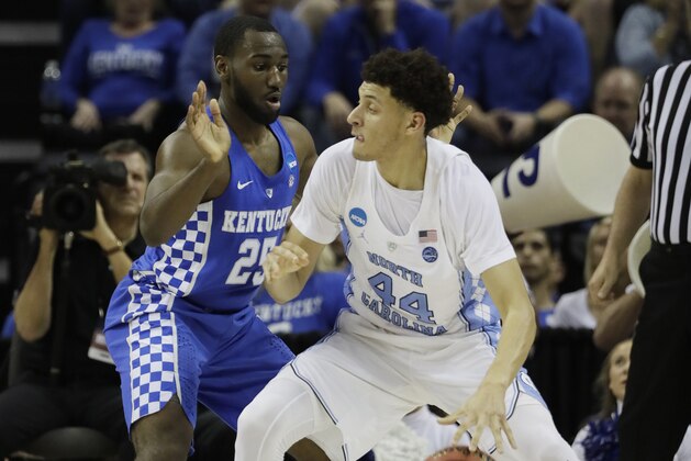 North Carolina forward Justin Jackson (44) drives on Kentucky guard Dominique Hawkins (25) in the first half of the South Regional final game in the NCAA college basketball tournament Sunday, March 26, 2017, in Memphis, Tenn. (AP Photo/Mark Humphrey)