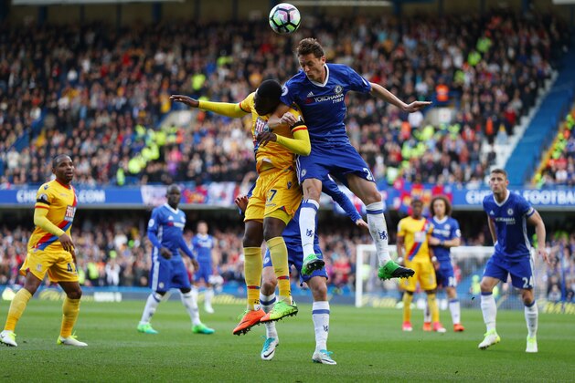 LONDON, ENGLAND - APRIL 01: Christian Benteke of Crystal Palace (L) and Nemanja Matic of Chelsea (R) battle to win a header during the Premier League match between Chelsea and Crystal Palace at Stamford Bridge on April 1, 2017 in London, England.  (Photo by Ian Walton/Getty Images)