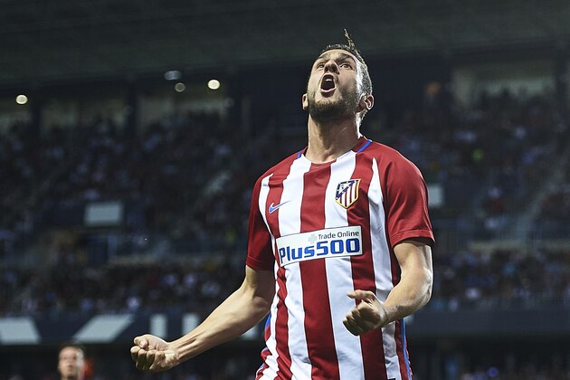 MALAGA, SPAIN - APRIL 01:  Koke Resurreccion of Club Atletico de Madrid (L) celebrates after scoring the first goal for Club Atletico de Madrid during La Liga match between Malaga CF and Club Atletico de Madrid at La Rosaleda Stadium April 01, 2017 in Malaga, Spain.  (Photo by Aitor Alcalde/Getty Images)