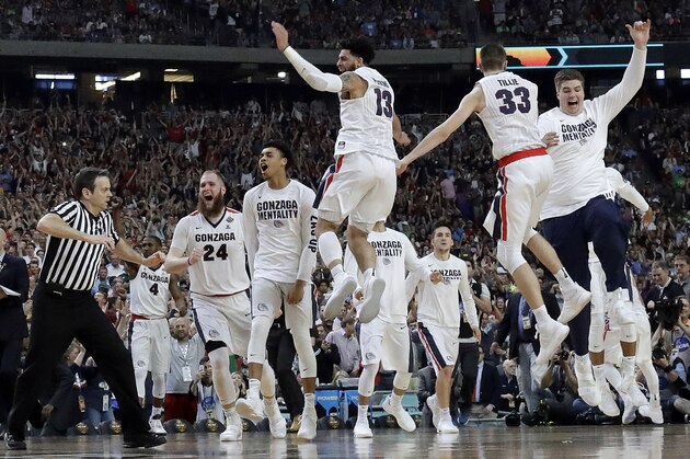 Gonzaga players celebrate after the semifinals of the Final Four NCAA college basketball tournament against South Carolina, Saturday, April 1, 2017, in Glendale, Ariz. Gonzaga won 77-73. (AP Photo/David J. Phillip)