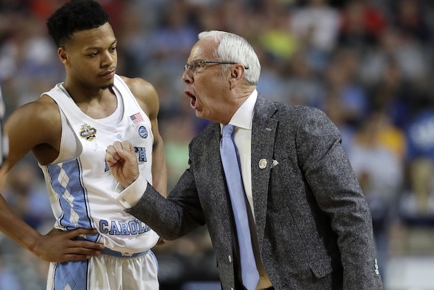 North Carolina head coach Roy Williams, right talks to Nate Britt during the second half in the semifinals of the Final Four NCAA college basketball tournament against Oregon, Saturday, April 1, 2017, in Glendale, Ariz. (AP Photo/Mark Humphrey)