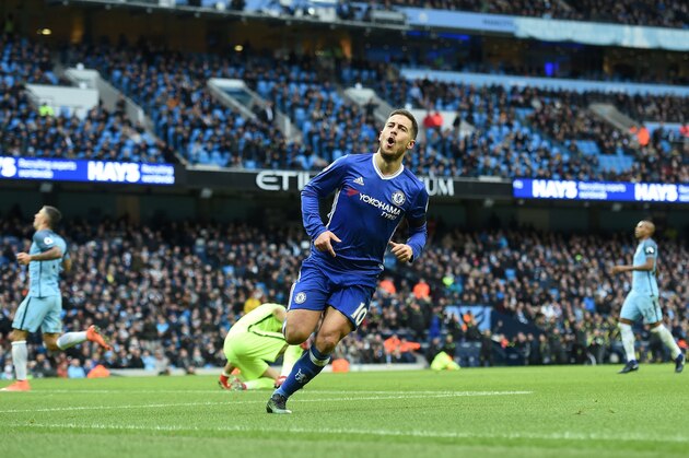 Chelsea's Belgian midfielder Eden Hazard celebrates scoring his team's third goal during the English Premier League football match between Manchester City and Chelsea at the Etihad Stadium in Manchester, north west England, on December 3, 2016. / AFP / Paul ELLIS / RESTRICTED TO EDITORIAL USE. No use with unauthorized audio, video, data, fixture lists, club/league logos or 'live' services. Online in-match use limited to 75 images, no video emulation. No use in betting, games or single club/league/player publications.  /         (Photo credit should read PAUL ELLIS/AFP/Getty Images)