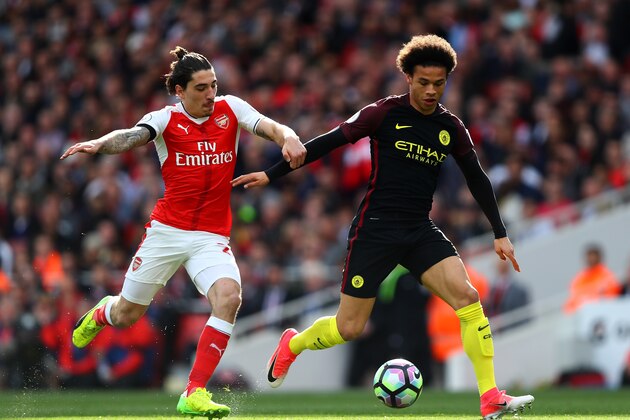 LONDON, ENGLAND - APRIL 02: Hector Bellerin of Arsenal (L) and Leroy Sane of Manchester City (R) battle for possession during the Premier League match between Arsenal and Manchester City at Emirates Stadium on April 2, 2017 in London, England.  (Photo by Clive Rose/Getty Images)