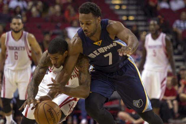 Houston Rockets guard Gary Payton II, left, and Memphis Grizzlies forward Wayne Selden, Jr. chase the ball during overtime of a preseason NBA basketball game Saturday, Oct. 15, 2016, in Houston. (AP Photo/Richard Carson)
