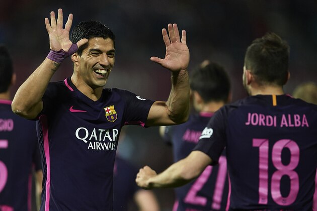 GRANADA, SPAIN - APRIL 02:  Luis Suarez of FC Barcelona celebrates after scoring the first goal for FC Barcelona with his team mate Jordi Alba of FC Barcelona during the La Liga match between Granada CF v FC Barcelona at Estadio Nuevo Los Carmenes on April 02, 2017 in Granada, Spain.  (Photo by Aitor Alcalde/Getty Images)