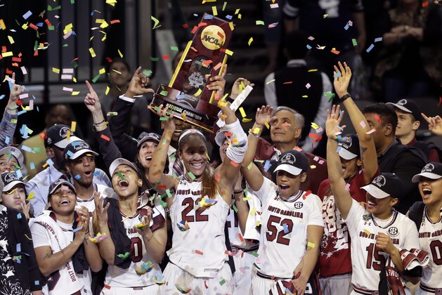 South Carolina forward A'ja Wilson (22) holds the trophy as she and teammates celebrate their win over Mississippi State in the final of NCAA women's Final Four college basketball tournament, Sunday, April 2, 2017, in Dallas. (AP Photo/Eric Gay)