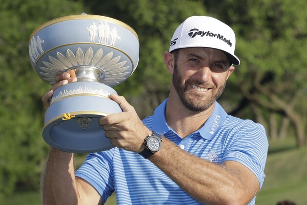 Dustin Johnson holds his trophy after defeating Jon Rahm of Spain at the Dell Technologies Match Play golf tournament at Austin County Club, Sunday, March 26, 2017, in Austin, Texas. (AP Photo/Eric Gay)