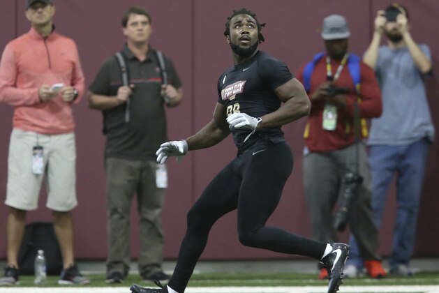 Dalvin Cook waits on a pass as he runs a drill for NFL scouts during Florida State's pro day, Tuesday, March 28, 2017 in Tallahassee, Fla. (AP Photo/Steve Cannon)