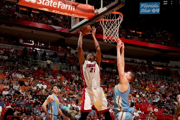 MIAMI, FL - APRIL 2:  Hassan Whiteside #21 of the Miami Heat goes to the basket against the Denver Nuggets on April 2, 2017 at American Airlines Arena in Miami, Florida. NOTE TO USER: User expressly acknowledges and agrees that, by downloading and or using this Photograph, user is consenting to the terms and conditions of the Getty Images License Agreement. Mandatory Copyright Notice: Copyright 2017 NBAE (Photo by Issac Baldizon/NBAE via Getty Images)