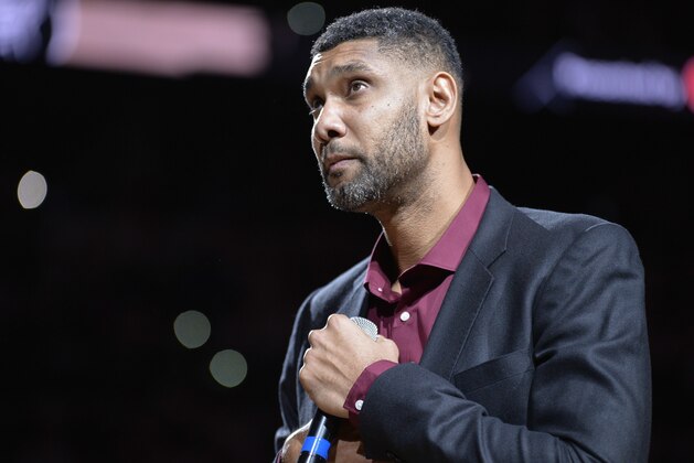 San Antonio Spurs legend Tim Duncan speaks to fans during his jersey retirement ceremony Sunday, Dec. 18, 2016, in San Antonio. (AP Photo/Darren Abate)
