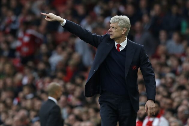 Arsenal's French manager Arsene Wenger gestures on the touchline during the English Premier League football match between Arsenal and Manchester City at The Emirates in London, on April 2, 2017.
The game finished 2-2. / AFP PHOTO / IKIMAGES / Ian KINGTON / RESTRICTED TO EDITORIAL USE. No use with unauthorized audio, video, data, fixture lists, club/league logos or 'live' services. Online in-match use limited to 45 images, no video emulation. No use in betting, games or single club/league/player publications.        (Photo credit should read IAN KINGTON/AFP/Getty Images)