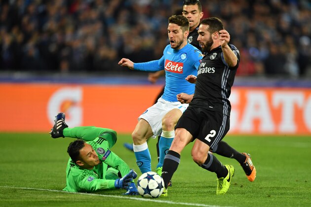 Napoli's forward from Belgium Dries Mertens (C) tries to score against Real Madrid's defender Dani Carvajal (R) and Real Madrid's Costa Rican goalkeeper Keylor Navas during the UEFA Champions League football match SSC Napoli vs Real Madrid on March 7, 2017 at the San Paolo stadium in Naples. / AFP PHOTO / Alberto PIZZOLI        (Photo credit should read ALBERTO PIZZOLI/AFP/Getty Images)