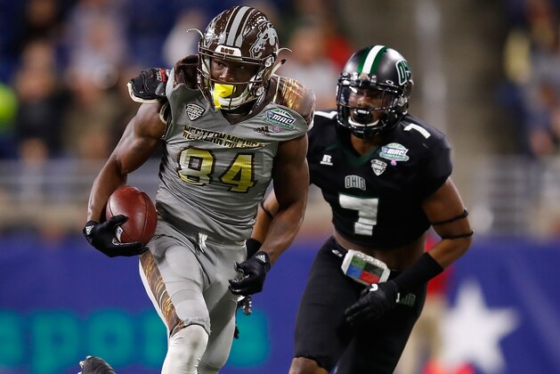 DETROIT, MI - DECEMBER 02: Corey Davis #84 of the Western Michigan Broncos outruns the tackle of Javon Hagan #7 of the Ohio Bobcats after a first half catch during the MAC Championship on December 2, 2016 at Ford Field in Detroit, Michigan. (Photo by Gregory Shamus/Getty Images)