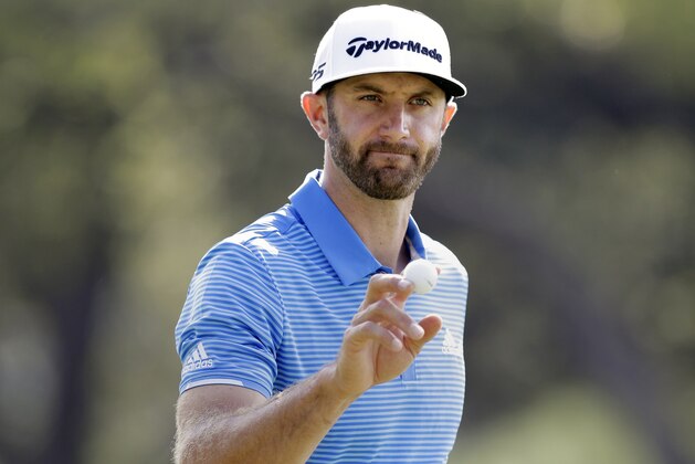 Dustin Johnson waves to the gallery after a birdie putt on the sixth hole during semifinal play at the Dell Technologies Match Play golf tournament at Austin County Club, Sunday, March 26, 2017, in Austin, Texas. (AP Photo/Eric Gay)