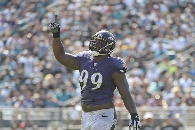 Baltimore Ravens defensive end Timmy Jernigan (99) celebrates a big play against the Jacksonville Jaguars during the second half of an NFL football game in Jacksonville, Fla., Sunday, Sept. 25, 2016. (AP Photo/Phelan M. Ebenhack)