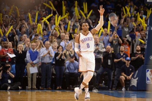 Apr 4, 2017; Oklahoma City, OK, USA; Oklahoma City Thunder guard Russell Westbrook (0) reacts as it announced that he has tied the season triple double record in action against the Milwaukee Bucks at Chesapeake Energy Arena. Mandatory Credit: Mark D. Smith-USA TODAY Sports