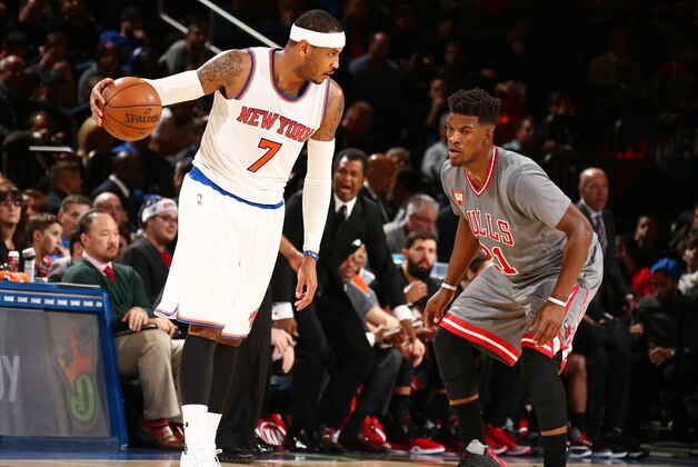 NEW YORK, NY - DECEMBER 19: Carmelo Anthony #7 of the New York Knicks defends the ball against Jimmy Butler #21 of the Chicago Bulls during the game on December 19, 2015 at Madison Square Garden in New York, New York. NOTE TO USER: User expressly acknowledges and agrees that, by downloading and or using this Photograph, user is consenting to the terms and conditions of the Getty Images License Agreement. Mandatory Copyright Notice: Copyright 2015 NBAE (Photo by Nathaniel S. Butler/NBAE via Getty Images)