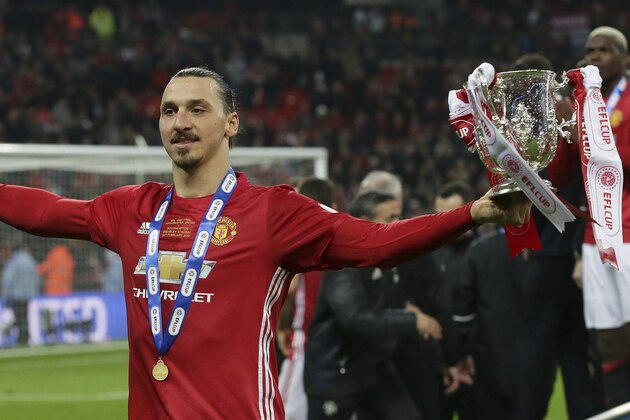 Manchester United's Zlatan Ibrahimovic holds the trophy after Manchester won the English League Cup final soccer match between Manchester United and Southampton FC at Wembley stadium in London, Sunday, Feb. 26, 2017. (AP Photo/Tim Ireland)