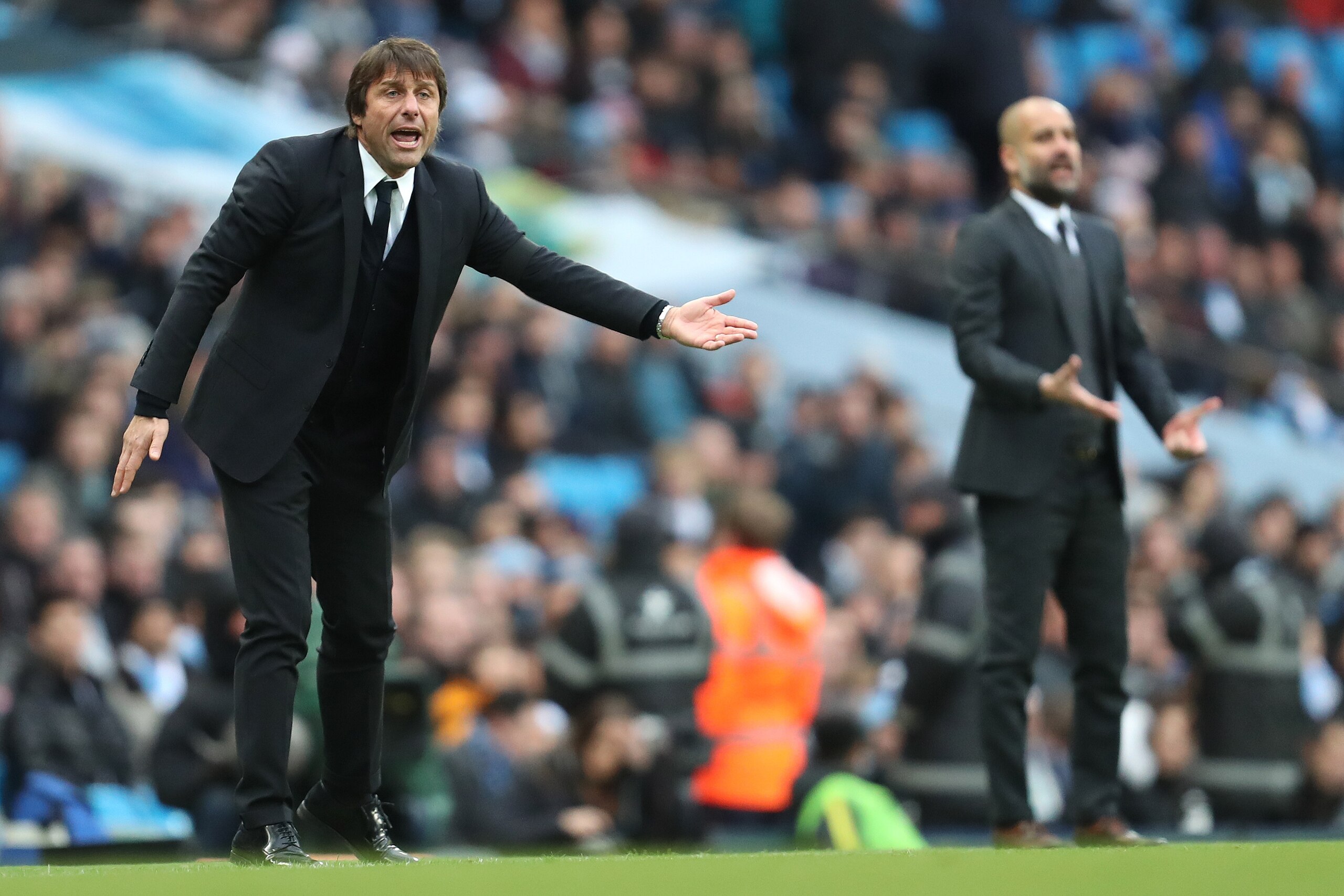 MANCHESTER, ENGLAND - DECEMBER 03:  Chelsea Manager / Head Coach Antonio Conte and Pep Guardiola react during the Premier League match between Manchester City and Chelsea at Etihad Stadium on December 3, 2016 in Manchester, England.  (Photo by James Baylis - AMA/Getty Images)