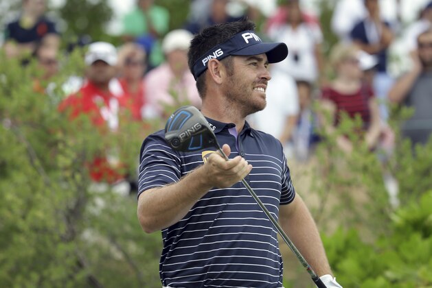 Louis Oosthuizen, of South Africa, watches his tee shot during the final round at the Hero World Challenge golf tournament, Sunday, Dec. 4, 2016, in Nassau, Bahamas. (AP Photo/Lynne Sladky)