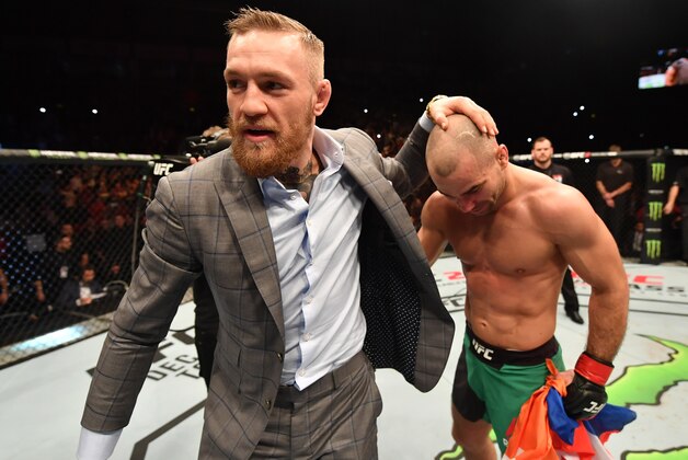 BELFAST, NORTHERN IRELAND - NOVEMBER 19:  (L-R) Artem Lobov of Russia celebrates with teammate and UFC champion Conor McGregor after his featherweight bout against Teruto Ishihara during the UFC Fight Night at the SSE Arena on November 19, 2016 in Belfast, Northern Ireland.  Lobov defeated Ishihara by unanimous-decision. (Photo by Brandon Magnus/Zuffa LLC/Zuffa LLC via Getty Images)