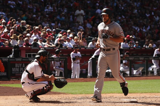 PHOENIX, AZ - APRIL 02:  Madison Bumgarner #40 of the San Francisco Giants crosses the plate after hitting a solo home run against the Arizona Diamondbacks during the fifth inning of the MLB opening day game at Chase Field on April 2, 2017 in Phoenix, Arizona.  (Photo by Christian Petersen/Getty Images)
