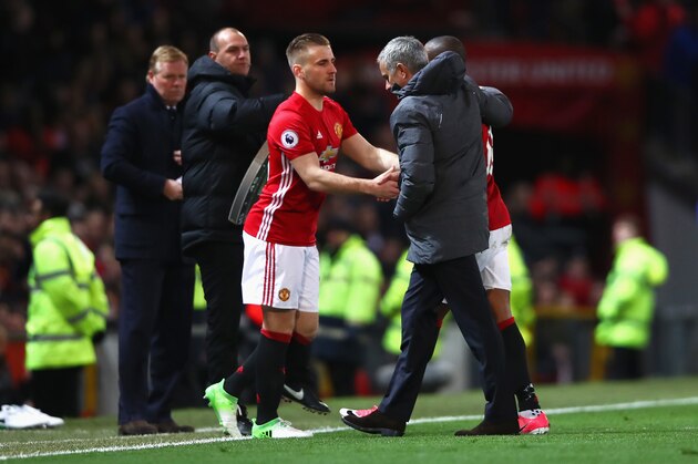 MANCHESTER, ENGLAND - APRIL 04: Luke Shaw of Manchester United (L) shakes hands with Jose Mourinho, Manager of Manchester United (R) during the Premier League match between Manchester United and Everton at Old Trafford on April 4, 2017 in Manchester, England.  (Photo by Clive Brunskill/Getty Images)