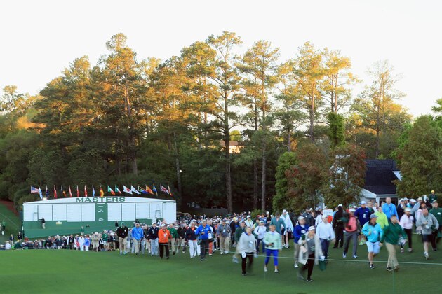 AUGUSTA, GA - APRIL 06:  Patrons walk onto the course next to the first fairway prior to the start of the first round of the 2017 Masters Tournament at Augusta National Golf Club on April 6, 2017 in Augusta, Georgia.  (Photo by Andrew Redington/Getty Images)