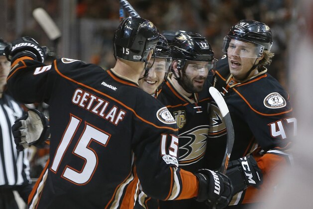 Anaheim Ducks center Ryan Kesler, second from right, celebrates his goal with center Ryan Getzlaf, left, defenseman Brandon Montour, second from left, and defenseman Hampus Lindholm, right, of Sweden, during the second period of an NHL hockey game against the Washington Capitals in Anaheim, Calif., Sunday, March 12, 2017. (AP Photo/Alex Gallardo)