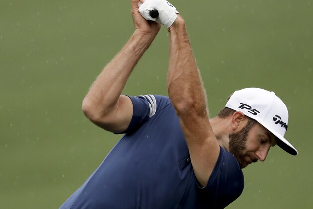 Dustin Johnson hits on the driving range during practice for the Masters golf tournament Monday, April 3, 2017, in Augusta, Ga. (AP Photo/Matt Slocum)