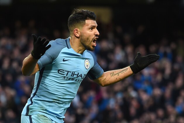 Manchester City's Argentinian striker Sergio Aguero celebrates after scoring during the English Premier League football match between Manchester City and Liverpool at the Etihad Stadium in Manchester, north west England, on March 19, 2017. / AFP PHOTO / PAUL ELLIS / RESTRICTED TO EDITORIAL USE. No use with unauthorized audio, video, data, fixture lists, club/league logos or 'live' services. Online in-match use limited to 75 images, no video emulation. No use in betting, games or single club/league/player publications.  /         (Photo credit should read PAUL ELLIS/AFP/Getty Images)
