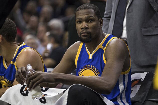 Golden State Warriors' Kevin Durant looks on from the bench during the second half of an NBA basketball game against the Philadelphia 76ers, Monday, Feb. 27, 2017, in Philadelphia. The Warriors won 119-108. (AP Photo/Chris Szagola)