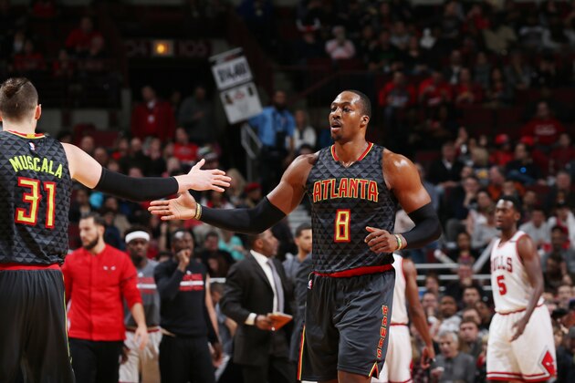 CHICAGO, IL - APRIL 1: Dwight Howard #8 and Mike Muscala #31 of the Atlanta Hawks shake hands during the game against the Chicago Bulls on April 1, 2017 at the United Center in Chicago, Illinois. NOTE TO USER: User expressly acknowledges and agrees that, by downloading and or using this Photograph, user is consenting to the terms and conditions of the Getty Images License Agreement. Mandatory Copyright Notice: Copyright 2017 NBAE (Photo by Gary Dineen/NBAE via Getty Images)