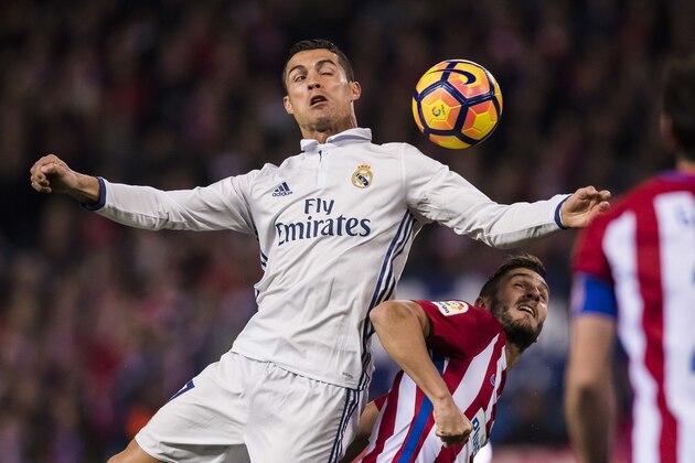 MADRID, SPAIN - NOVEMBER  19: Cristiano Ronaldo of Real Madrid fights for the ball with Koke of Atletico de Madrid during their La Liga match between Atletico de Madrid and Real Madrid at the Vicente Calderon Stadium on 19 November 2016 in Madrid, Spain. (Photo by Power Sport Images/Getty Images)